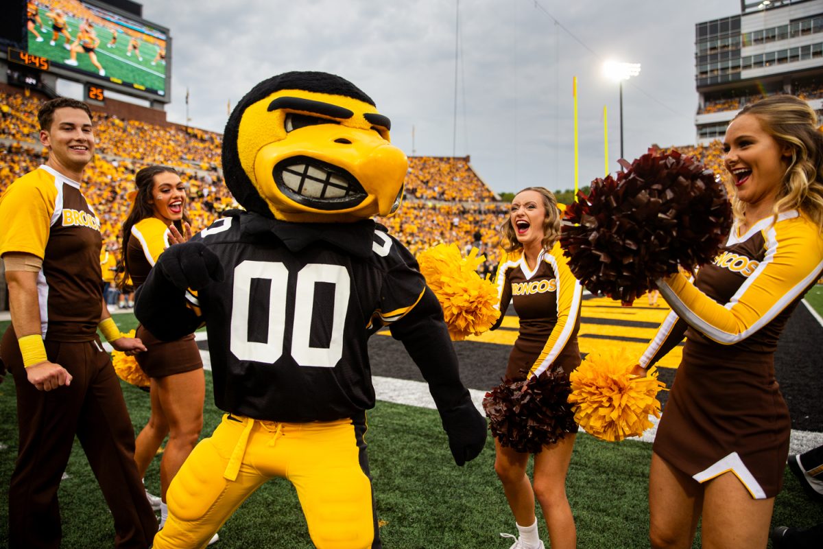 Iowa Hawkeyes fans celebrating in black and gold
